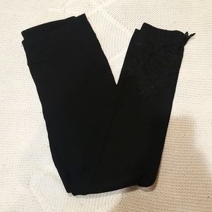 Black leggings with floral trim